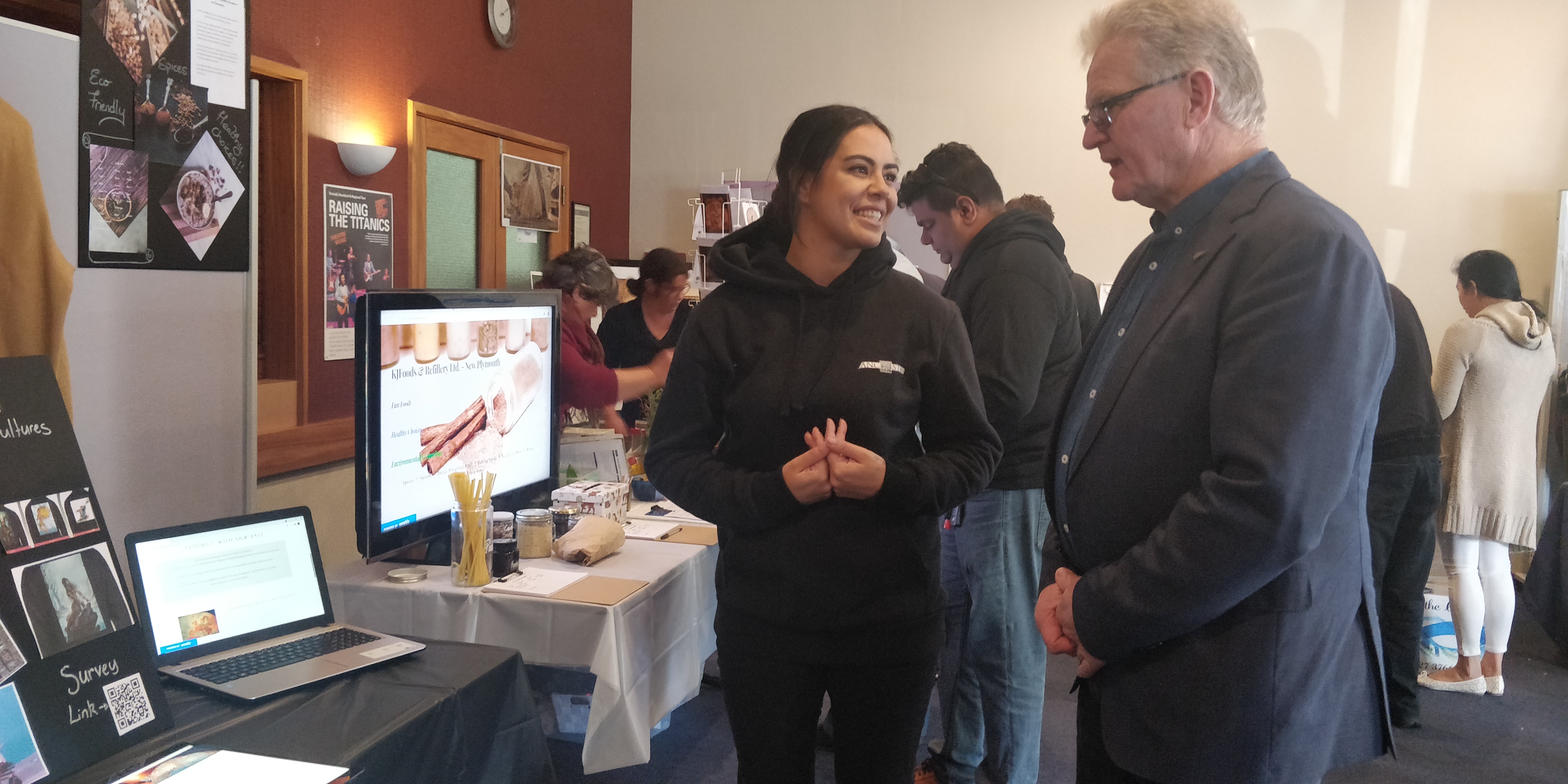 South Taranaki Mayor Phil Nixon talks to Janelle Ferries of the Rebel Business School at their business exhibition event.