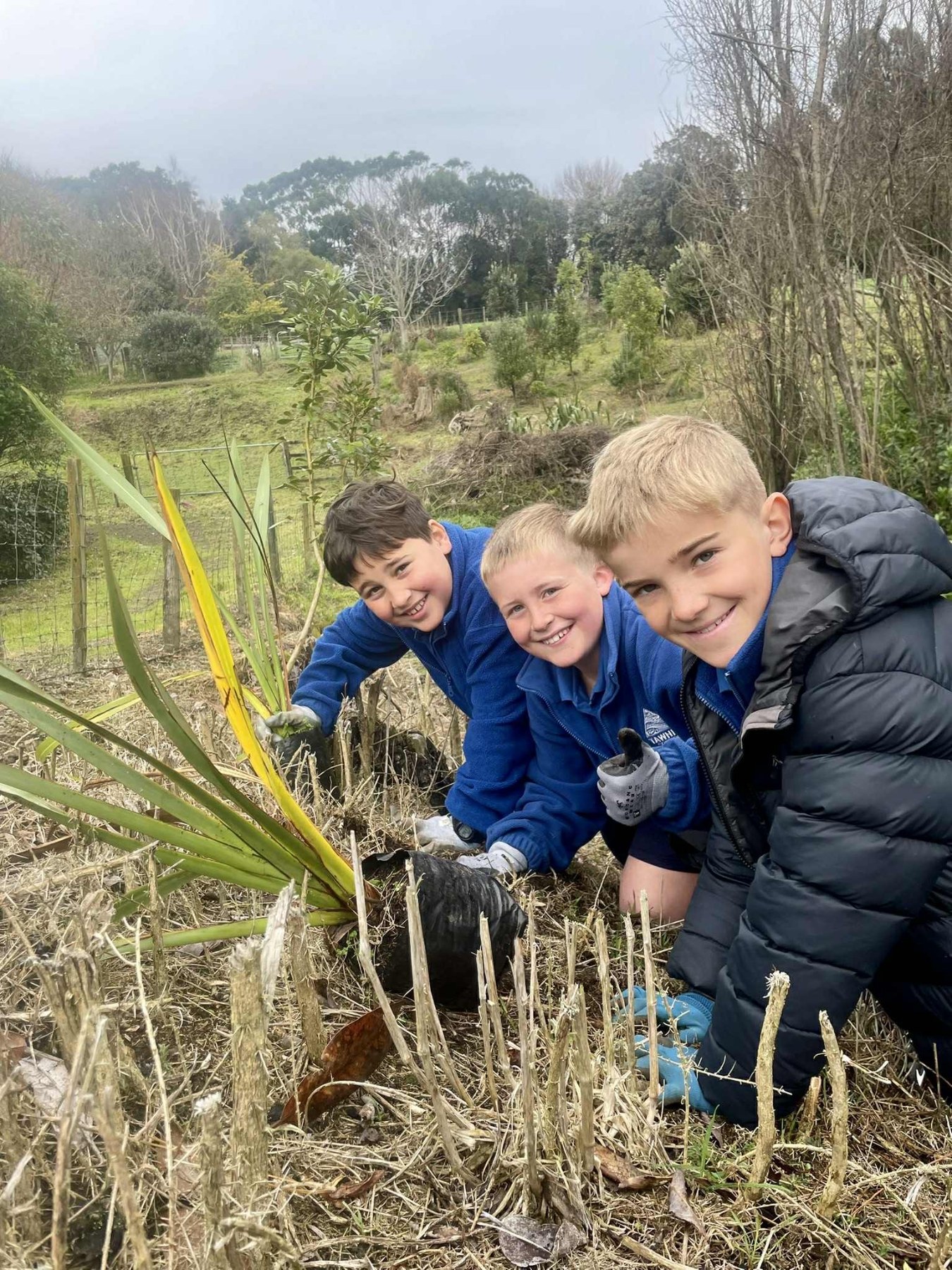 ​Tawhiti School students pictured helping with the planting at Scott Street Walkway, Hāwera. 