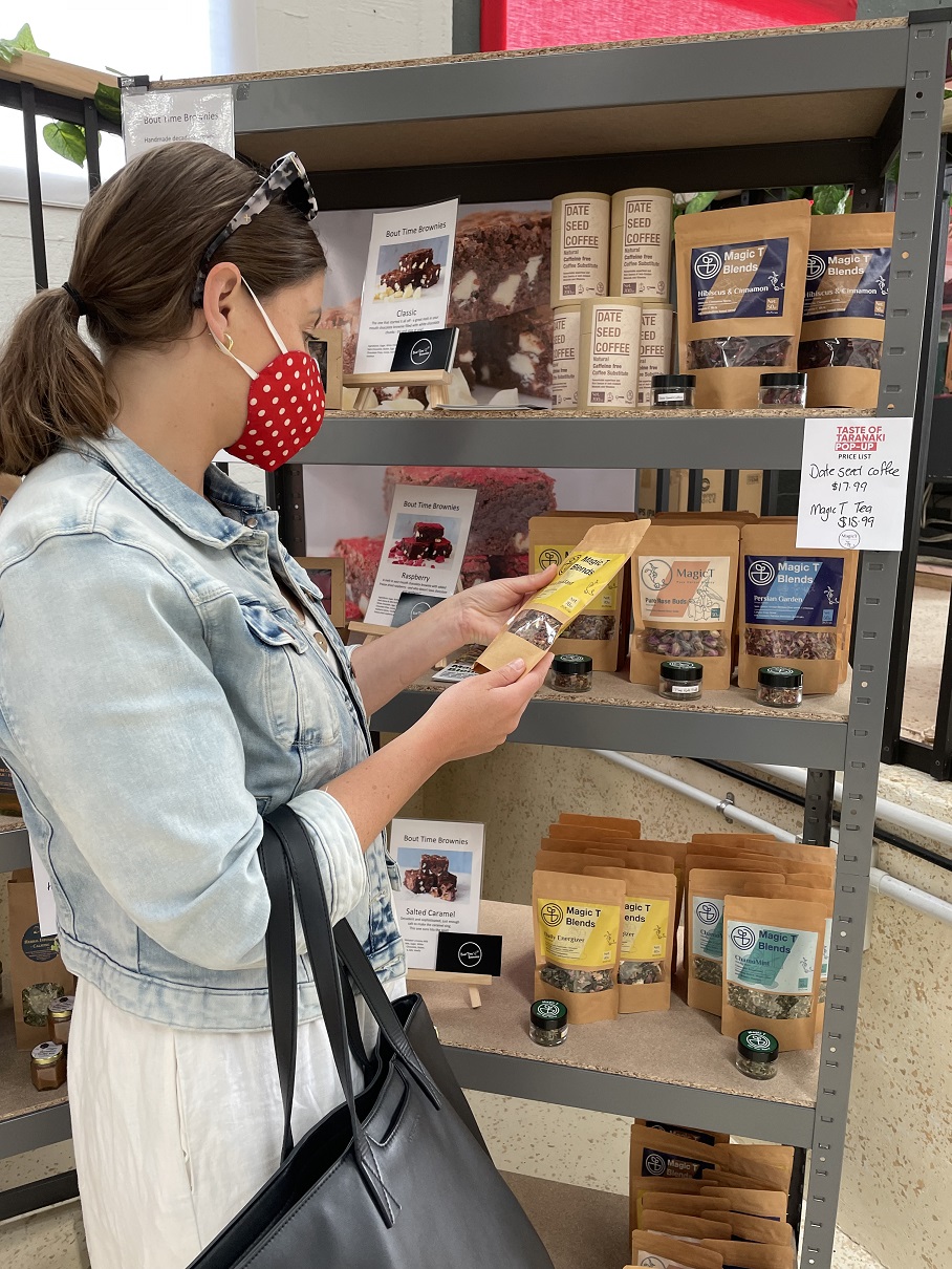customer browsing at Taste of Taranaki Pop-Up Shop in Eltham
