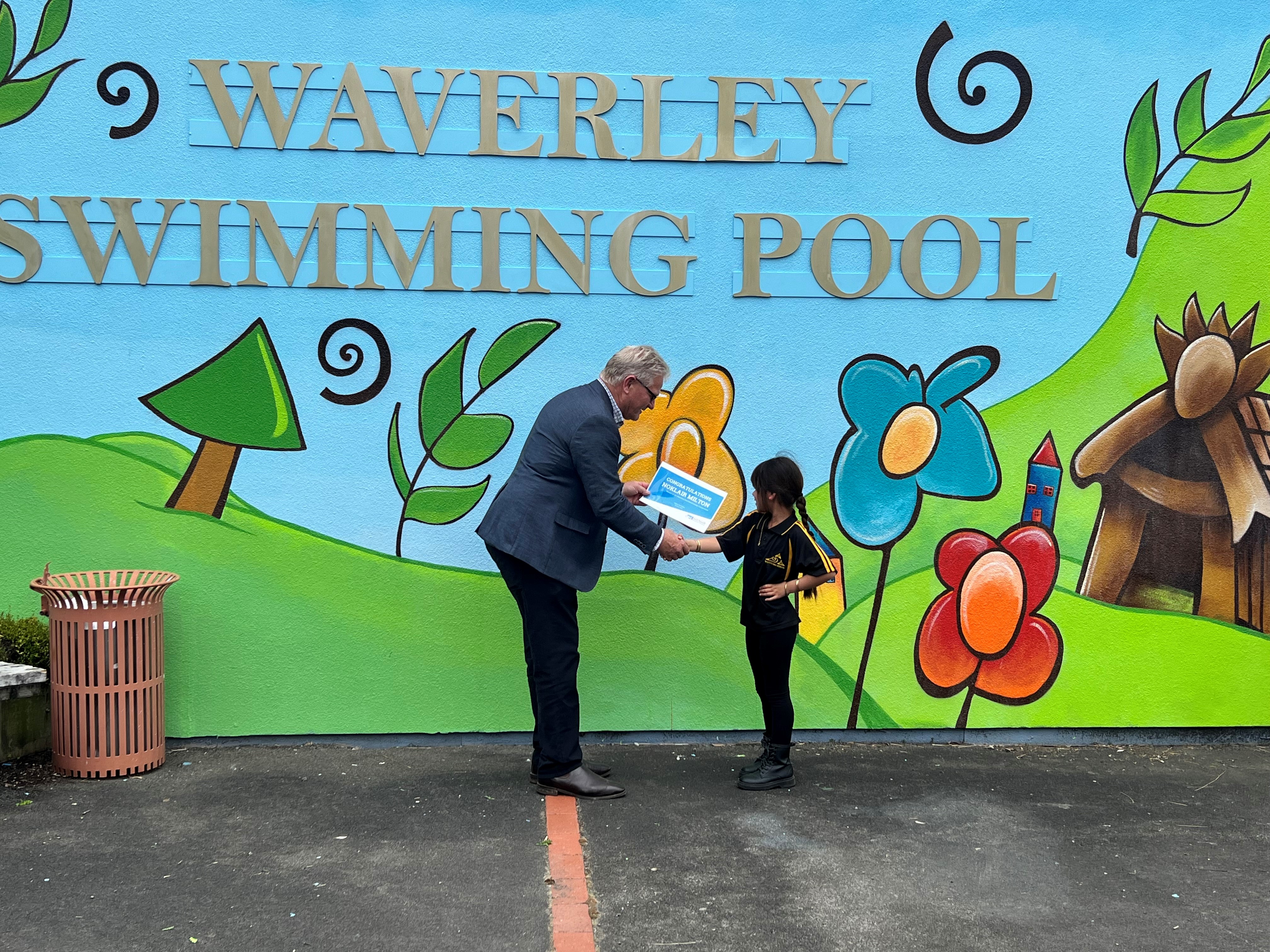 Noklair Milton from Waverley receives congratulations from South Taranaki Mayor Phil Nixon.