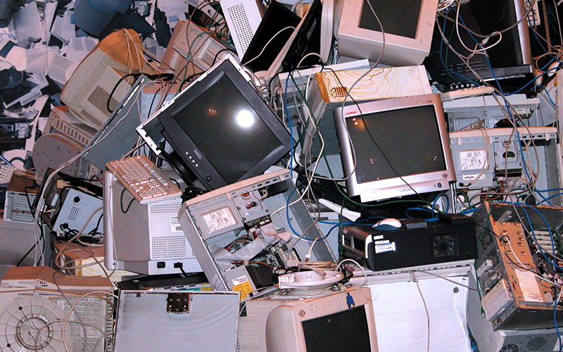 Image of electronic waste such as tv's, computers, keyboards etc